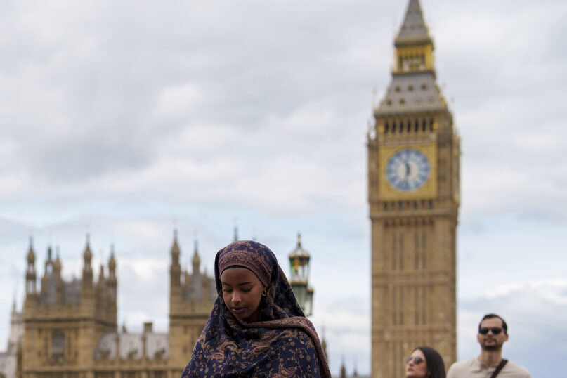 People walk on Westminster Bridge in London, Monday, July 1, 2024. The United Kingdom will hold its first national election in almost five years on Thursday, July 4, with opinion polls suggesting that Prime Minister Rishi Sunak's Conservative Party will be punished for failing to deliver on promises made during 14 years in power. (AP Photo/Vadim Ghirda)